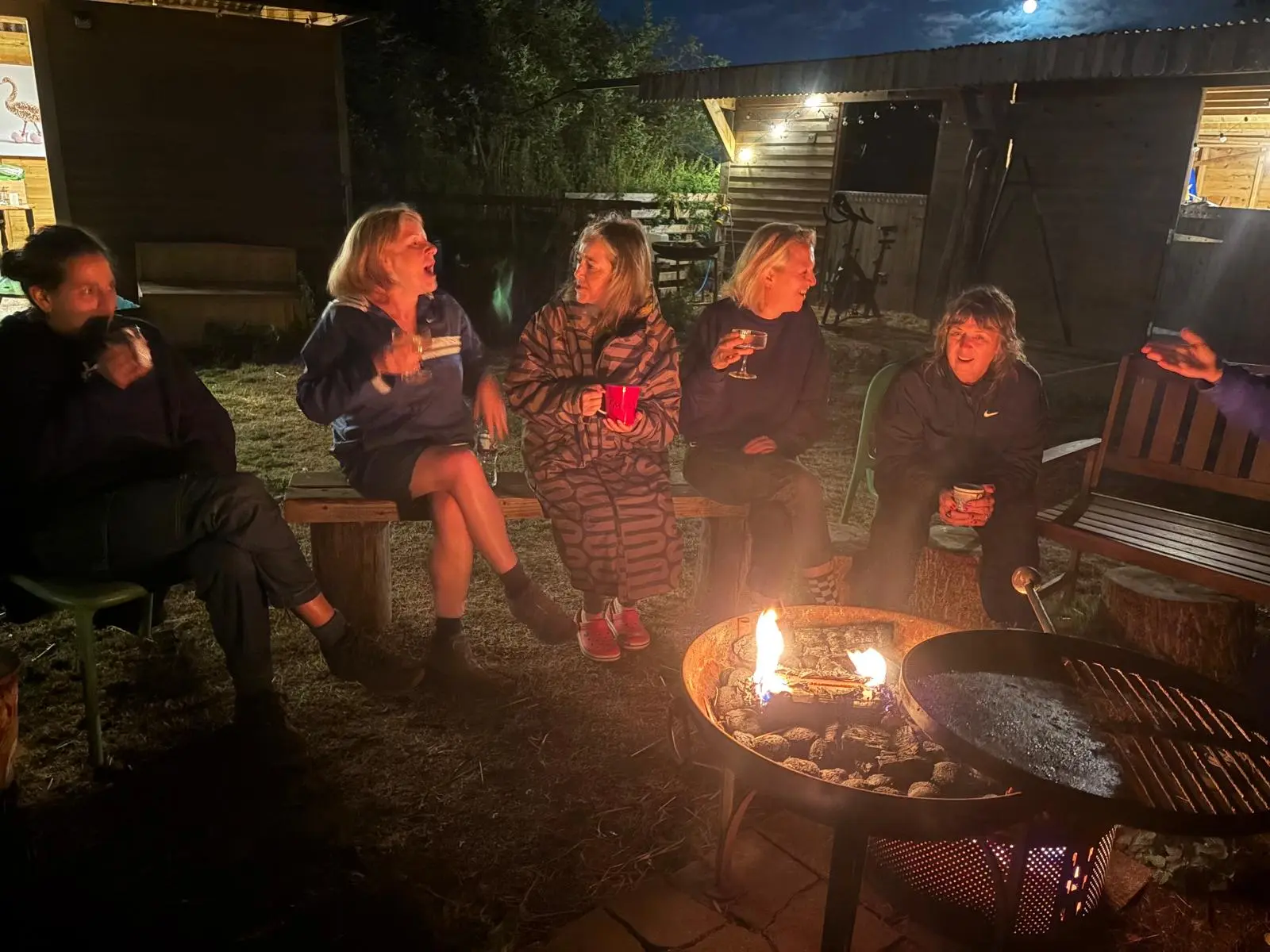 Friends gathered around the fire pit in the evening