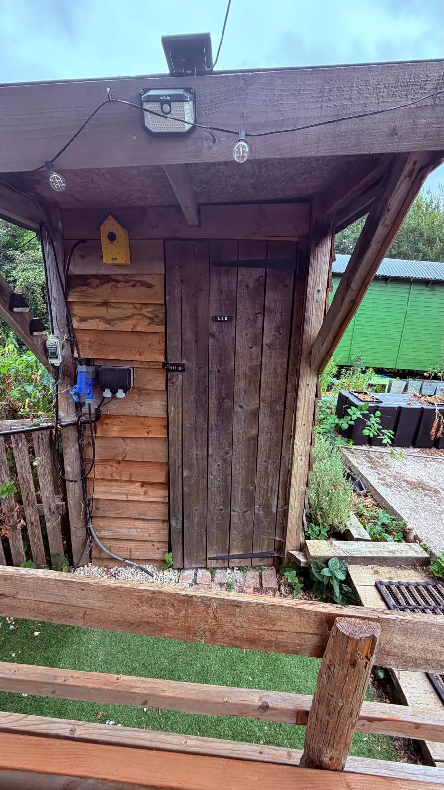 The wooden outdoor loo