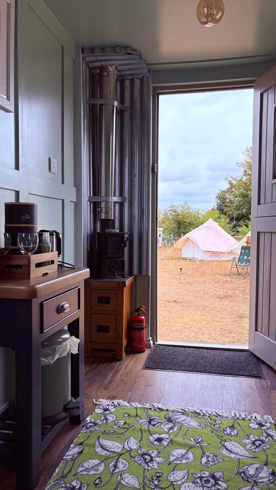 Wood burner and open door in the small hut